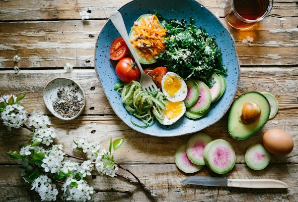 Colorful healthy bowls with vegetables and grains